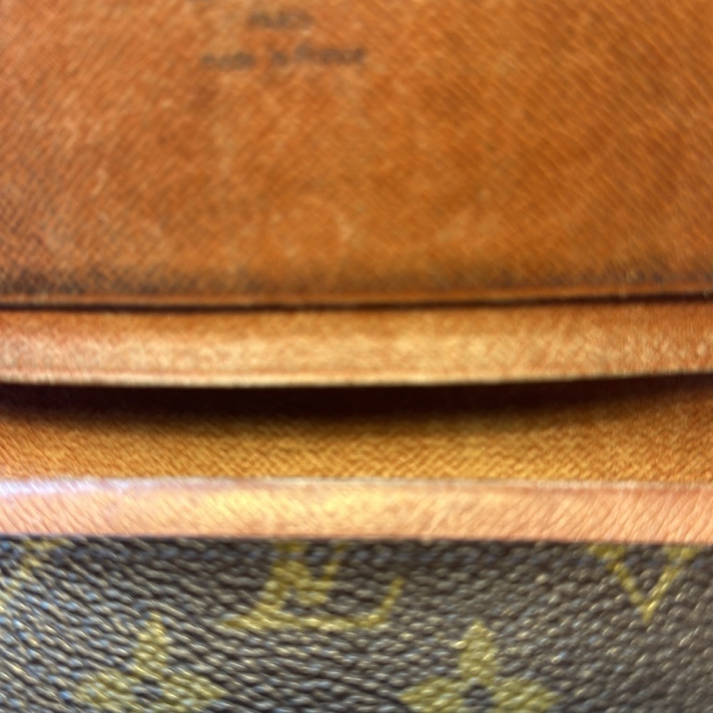 Louis Vuitton billfold. The dimensions are 6 inches wide and 4 inches. Authentic - Picture 4 of 10